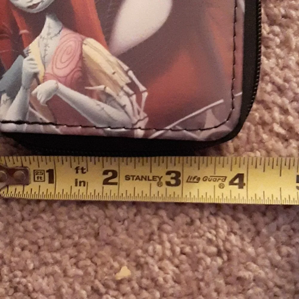 NWOT  Nightmare Before Christmas short wallet with zippered closure.